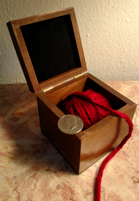 Coin in ball of wool