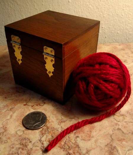 Coin in ball of wool